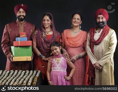 Portrait of a Sikh family with diyas