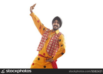 Portrait of a Sikh man doing bhangra dance