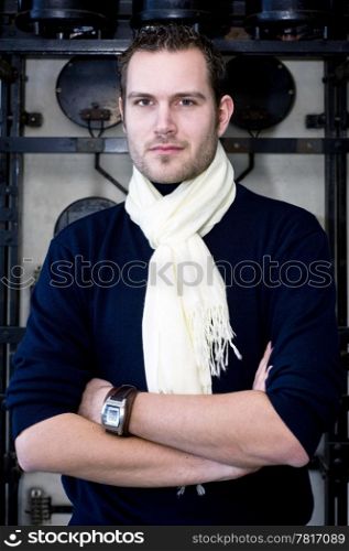Portrait of a smart looking designer with his arms crossed