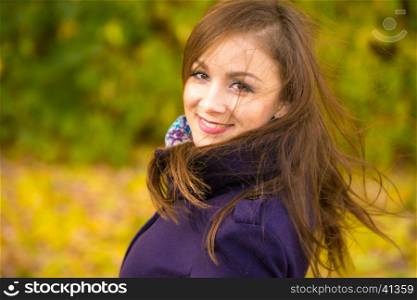 Portrait of a smiling beautiful girl with disheveled hair