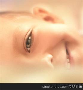 portrait of a smiling boy close-up, artistic image of a child