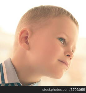 portrait of a smiling boy close-up, artistic image of a child