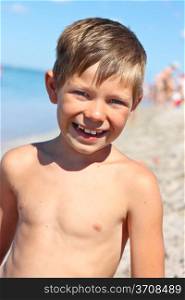 Portrait of a smiling boy on the sea beach
