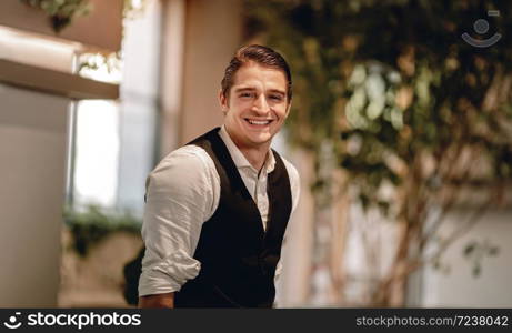 Portrait of a Smiling Caucasian Businessman, Look into the Camera in Comfortable Posture