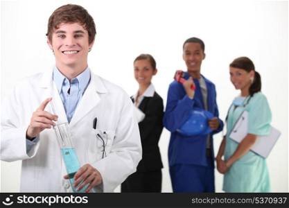 Portrait of a smiling chemist and different workers