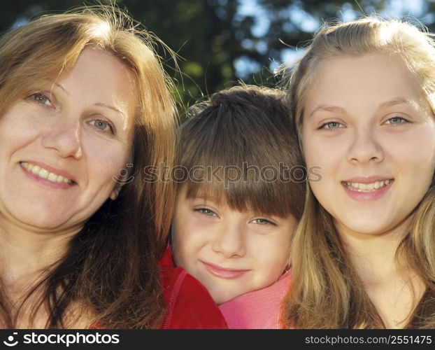 Portrait of a smiling family of mother and her children