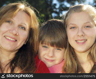 Portrait of a smiling family of mother and her children