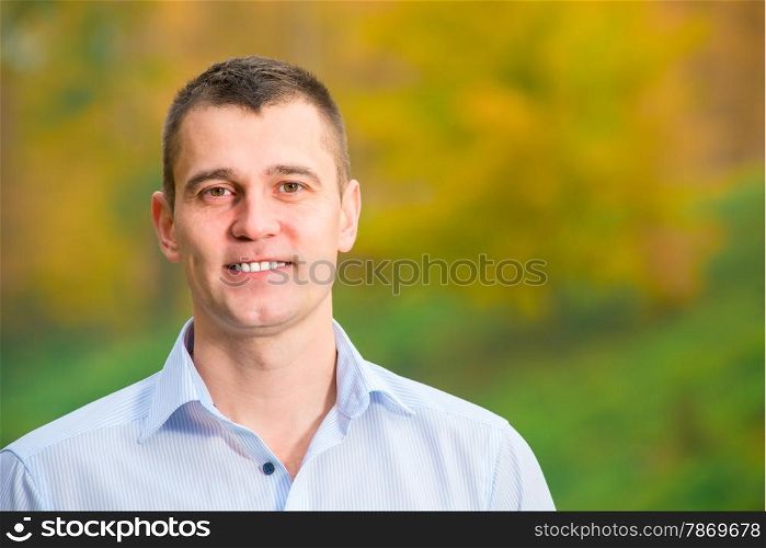portrait of a smiling man 35 years in the park