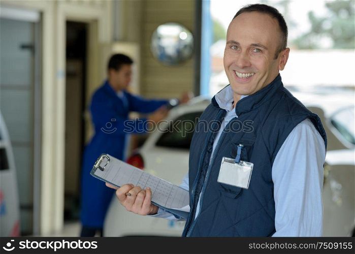portrait of a smiling mechanic supervisor