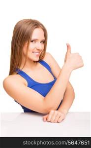 Portrait of a smiling woman showing thumbs up over white background