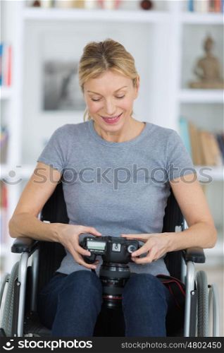 portrait of a smiling woman using a camera