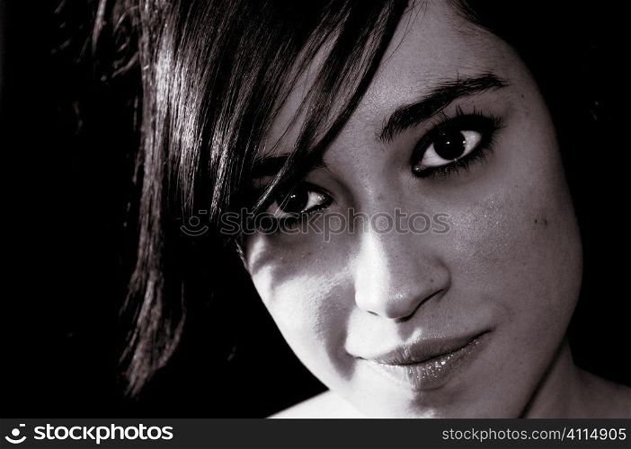 Portrait of a smiling woman with a short dark fringe