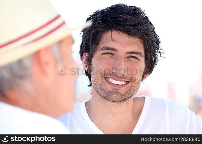 Portrait of a smiling young man outdoors