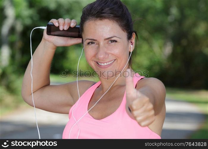 portrait of a sportswoman with thumb up
