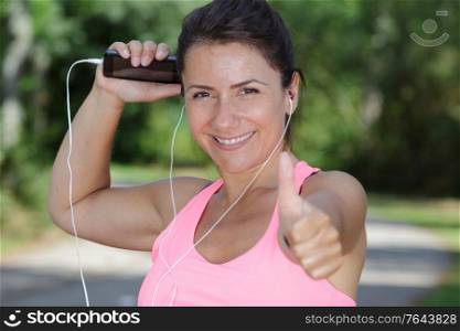 portrait of a sportswoman with thumb up