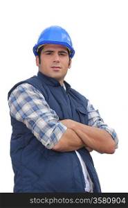 Portrait of a standoffish tradesman with his arms crossed