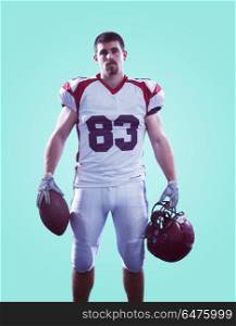 Portrait of a strong muscular American Football Player isolated on colorful background. American Football Player isolated on colorfull background