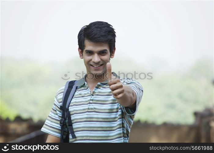 Portrait of a student giving a thumbs up