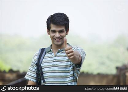 Portrait of a student giving a thumbs up