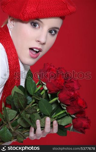 Portrait of a surprised woman holding roses