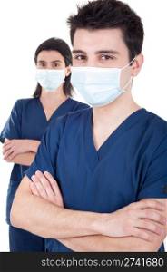 portrait of a team of doctors, man and woman wearing mask and uniform isolated on white background (selective focus)