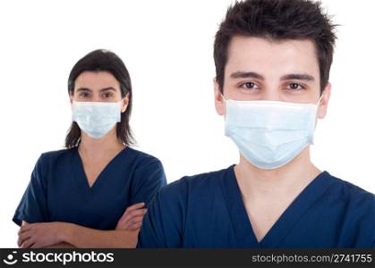 portrait of a team of doctors, man and woman wearing mask and uniform isolated on white background (focus on man)