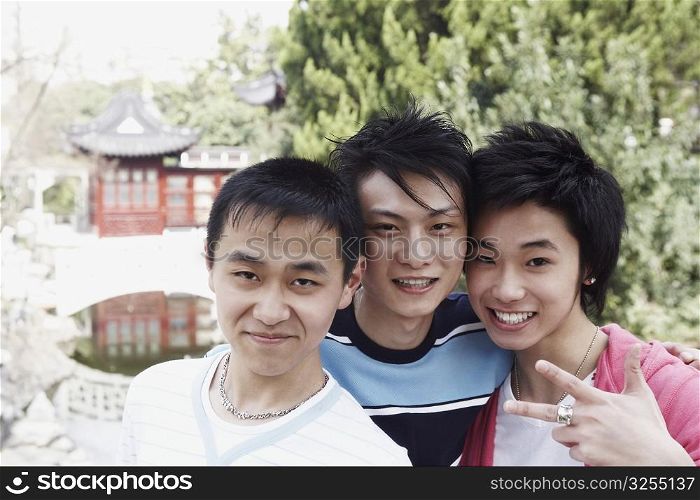 Portrait of a teenage boy and two young men