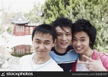 Portrait of a teenage boy and two young men