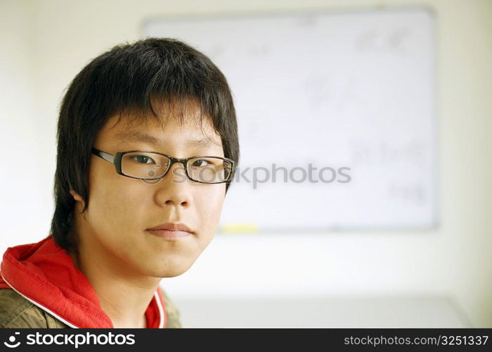 Portrait of a teenage boy in the classroom