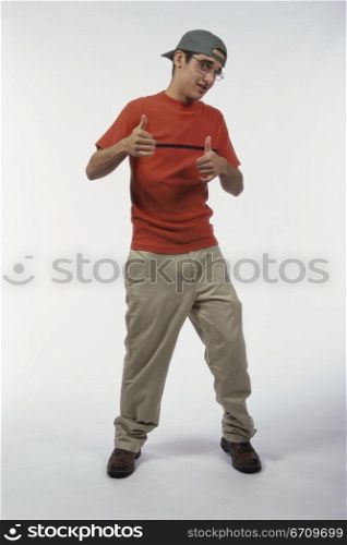 Portrait of a teenage boy showing thumbs up