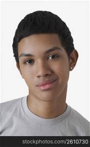 Portrait of a teenage boy smirking