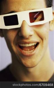 Portrait of a teenage boy wearing 3-D glasses