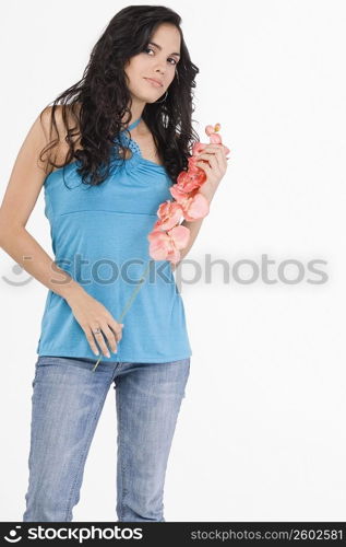 Portrait of a teenage girl holding flowers