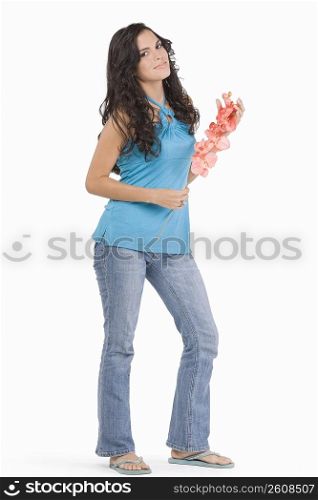 Portrait of a teenage girl holding flowers