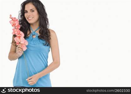 Portrait of a teenage girl holding flowers and smiling