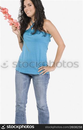 Portrait of a teenage girl holding flowers and smiling