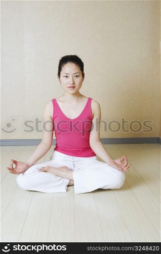 Portrait of a teenage girl meditating