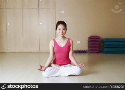Portrait of a teenage girl meditating