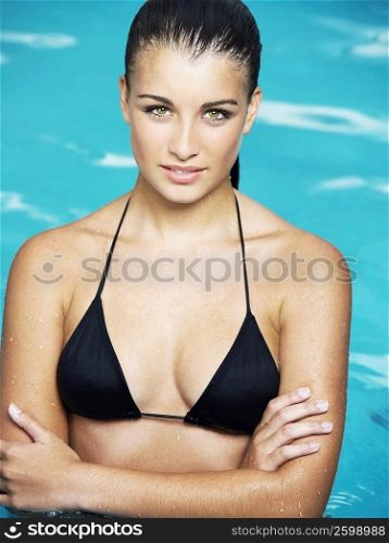 Portrait of a teenage girl posing in a swimming pool