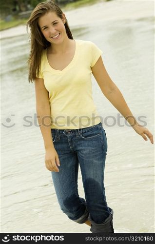 Portrait of a teenage girl walking on the beach