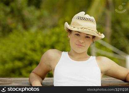 Portrait of a teenage girl wearing a sun hat