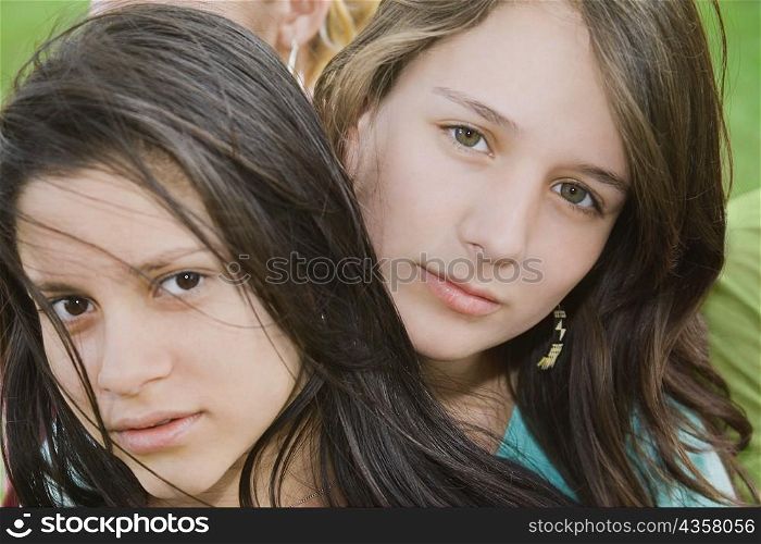 Portrait of a teenage girl with a young woman
