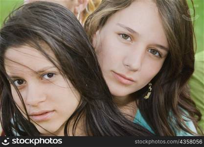Portrait of a teenage girl with a young woman