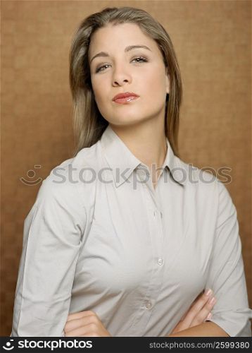 Portrait of a teenage girl with her arms crossed