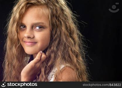 Portrait of a teenage girl with long curly hair