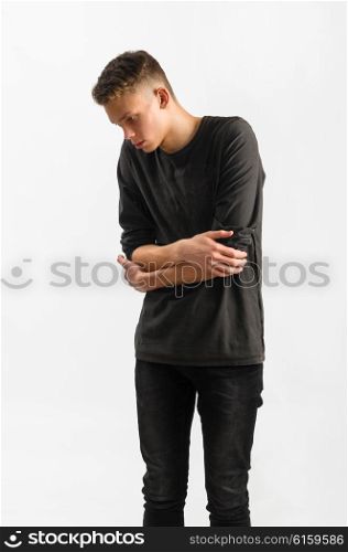 portrait of a teenager. portrait of a male caucasian teenager on gray background