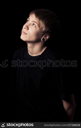 portrait of a teenager with toning on darken background