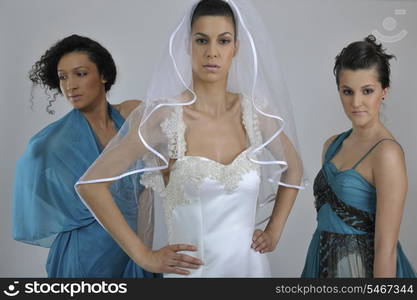 portrait of a three beautiful woman in wedding dress, bride and her friends bridesmaid