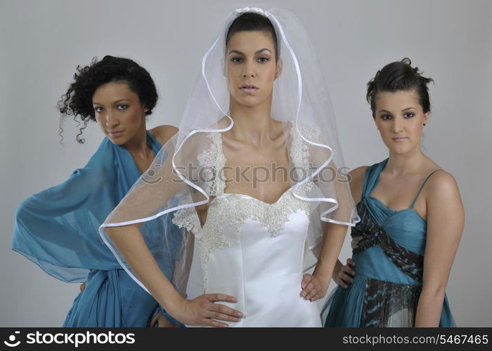 portrait of a three beautiful woman in wedding dress, bride and her friends bridesmaid