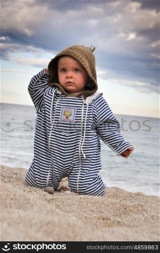 Portrait of a toddler in a sandy beach